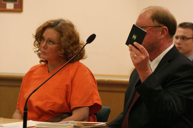 Peggy Sue Thomas stares at Island County Superior Court Judge Alan Hancock as her attorney