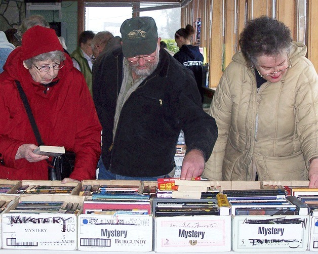 Shoppers browse the stacks at the Friends of Clinton Library book sale.