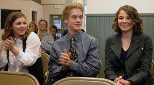 South Whidbey High School student Sydney Ackerman smiles sheepishly as her peers celebrate her nomination as the school board’s student representative.