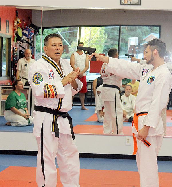 7th Degree Black Belt Senior Master Ken Church instructs students at Armstrong’s Taekwondo on self-defense and gun-defense.