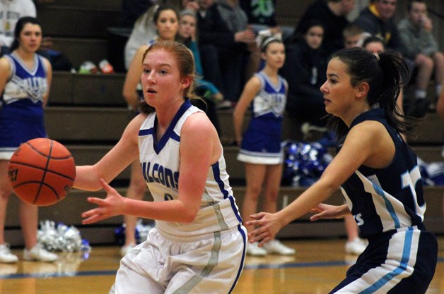South Whidbey Falcon senior Madi Boyd drives past Sultan Turk junior Khayla Mackenzie in the second quarter of the Cascade Conference game Friday