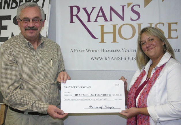 House of Prayer pastor Glen Horn presents a check to Lori Cavender