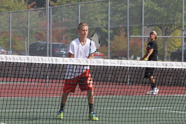 South Whidbey High School freshman Kody Newman waits for his teammate’s serve during the Falcons’ first practice of the season on Monday morning. Newman’s older siblings have made their mark on the program by winning state titles in singles. Now