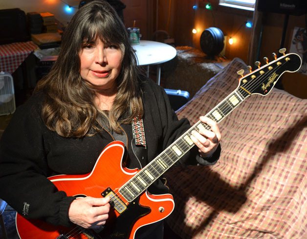 Rainey of the Rainey Music Project rehearses a song she wrote for the upcoming performance benefitting at-risk youth on the South End. The performance features all-original rock music the band wrote for the concert.
