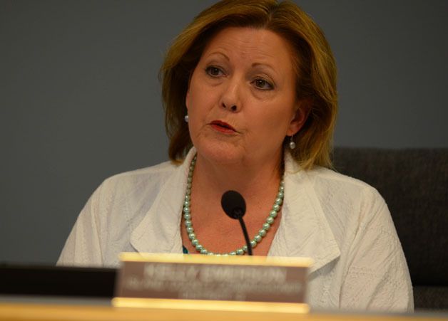 Island County Commissioner Kelly Emerson reads from a statement announcing a settlement in her long battle with Island County Planning and Community Development.