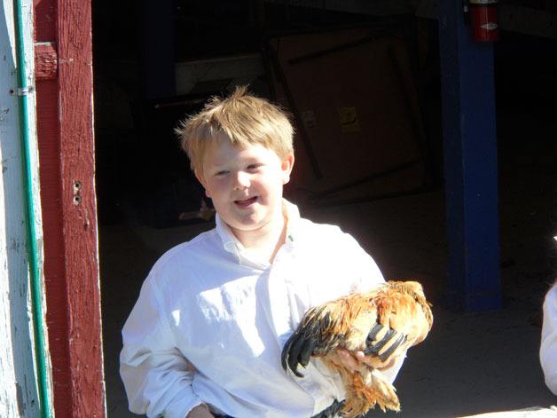 Rock N’Doodle Poultry Club member Adrian Cook holds his prize chicken