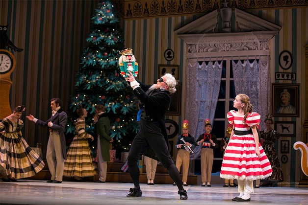 Pacific Northwest Ballet guest artist Uko Gorter as Drosselmeier and Isabelle Rookstool of Langley as Clara in George Balanchine’s “The Nutcracker.” PNB’s production features all new sets and costumes designed by children’s author and illustrator Ian Falconer (Olivia the Pig) and runs through Dec. 28.