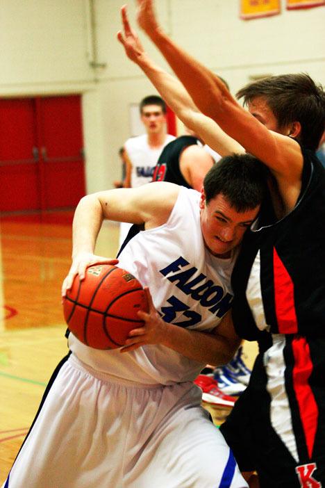 Falcon forward Tyler “Chuck” Norris tries to bull his way past a King’s defender Friday. South Whidbey lost 67-60