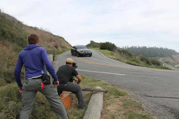 A film crew tapes a Lexus IS 350 FSPORT as it races onto Hill Road on Central Whidbey last week.  An episode of “Shut up and Drive” will appear on Fox Sports 1 Sunday