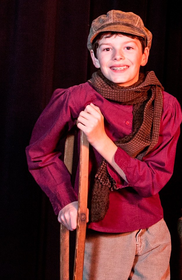 Liam Henny plays Tiny Tim in “Scrooge