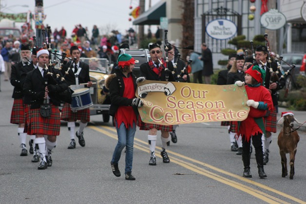 Participants march in Langley’s Holiday Parade in last year’s event. This year