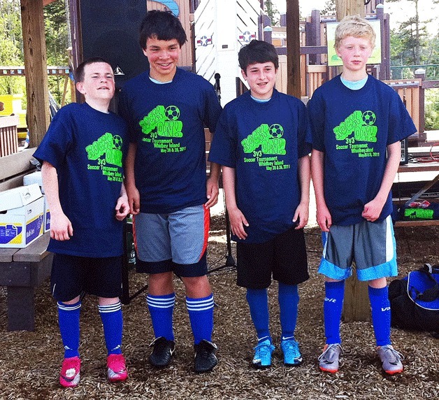 The South Whidbey U-13 team poses after winning the “Rock On!” soccer tournament. Pictured from left to right: Jordan Henriot