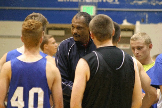 Falcon head coach Henry Pope speaks to his players during practice this month.