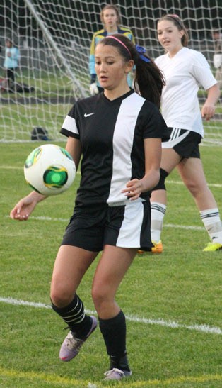 Falcon senior Maia Sparkman catches the ball near the Wolves' goal. She finished with three goals.