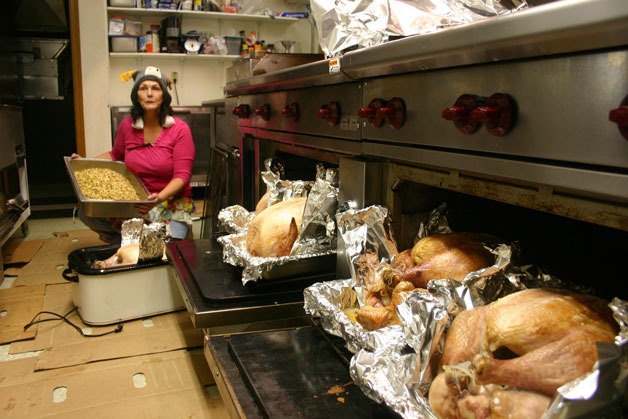 Joan Smith cooks turkeys at the Eagles Aerie kitchen near Freeland in preparation for the Mobile Turkey Unit delivery.  Smith is part of a team of volunteers who carry out the legacy of Tom Arontas