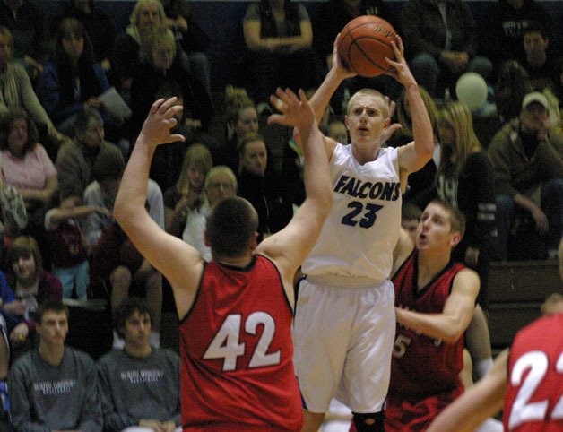 Riley Newman shoots over King’s defender Mason Friedline as Kyle Sawtell attempts to block the shot in action against King’s.