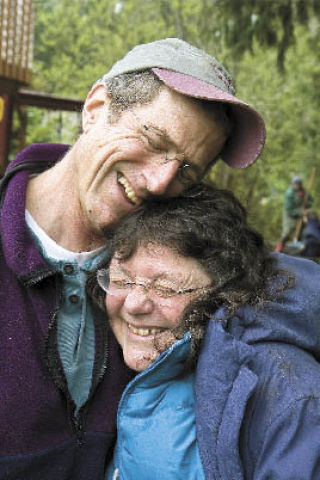 Homeowner Lynn Smith gives Hearts & Hammers volunteer Peter Martin a hug for fixing up her home. Hearts & Hammers helps families that are unable to make needed repairs to their homes because of health or financial reasons. The repairs are funded through grants and donations.