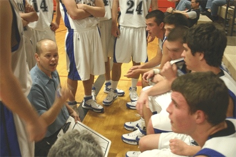 Falcon coach Scott Collins strategizes with his team in the fourth quarter during Thursdays 58-55 loss to Lakeside. The next day