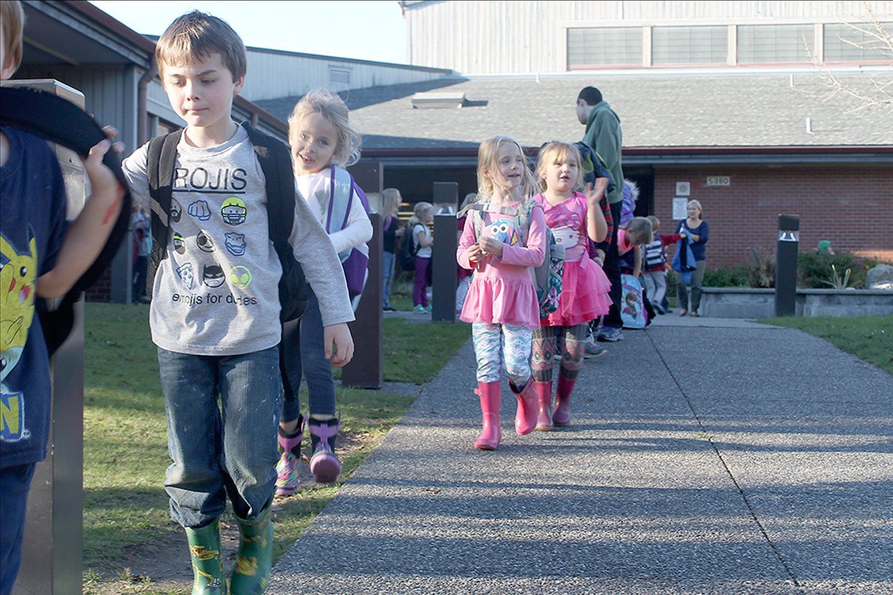 Evan Thompson / The Record                                South Whidbey Elementary School students head to the buses after school on Thursday afternoon. The South Whidbey School District is considering a consolidation of facilities which could result in the closure of the Langley Middle School or South Whidbey Primary School.