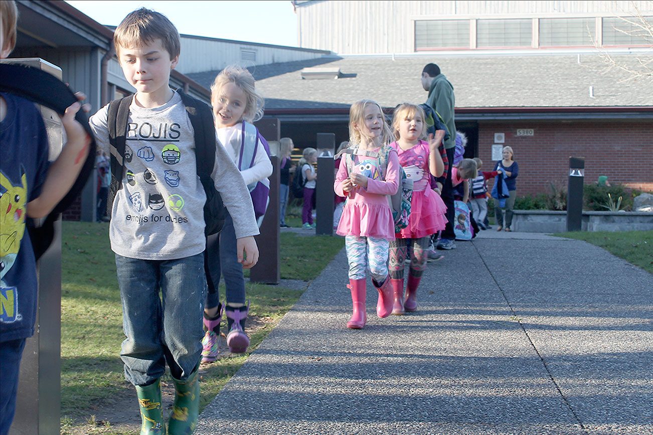 Evan Thompson / The Record                                South Whidbey Elementary School students head to the buses after school on Thursday afternoon. The South Whidbey School District is considering consolidation of school buildings which could reshuffle where kids go to school.