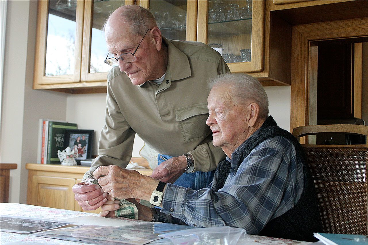 Evan Thompson / The Record                                Merle “Milo” Milfs (left) and George Clark (right), both, World War II veterans, gathered in Clark’s home in Freeland to discuss their service and experiences.