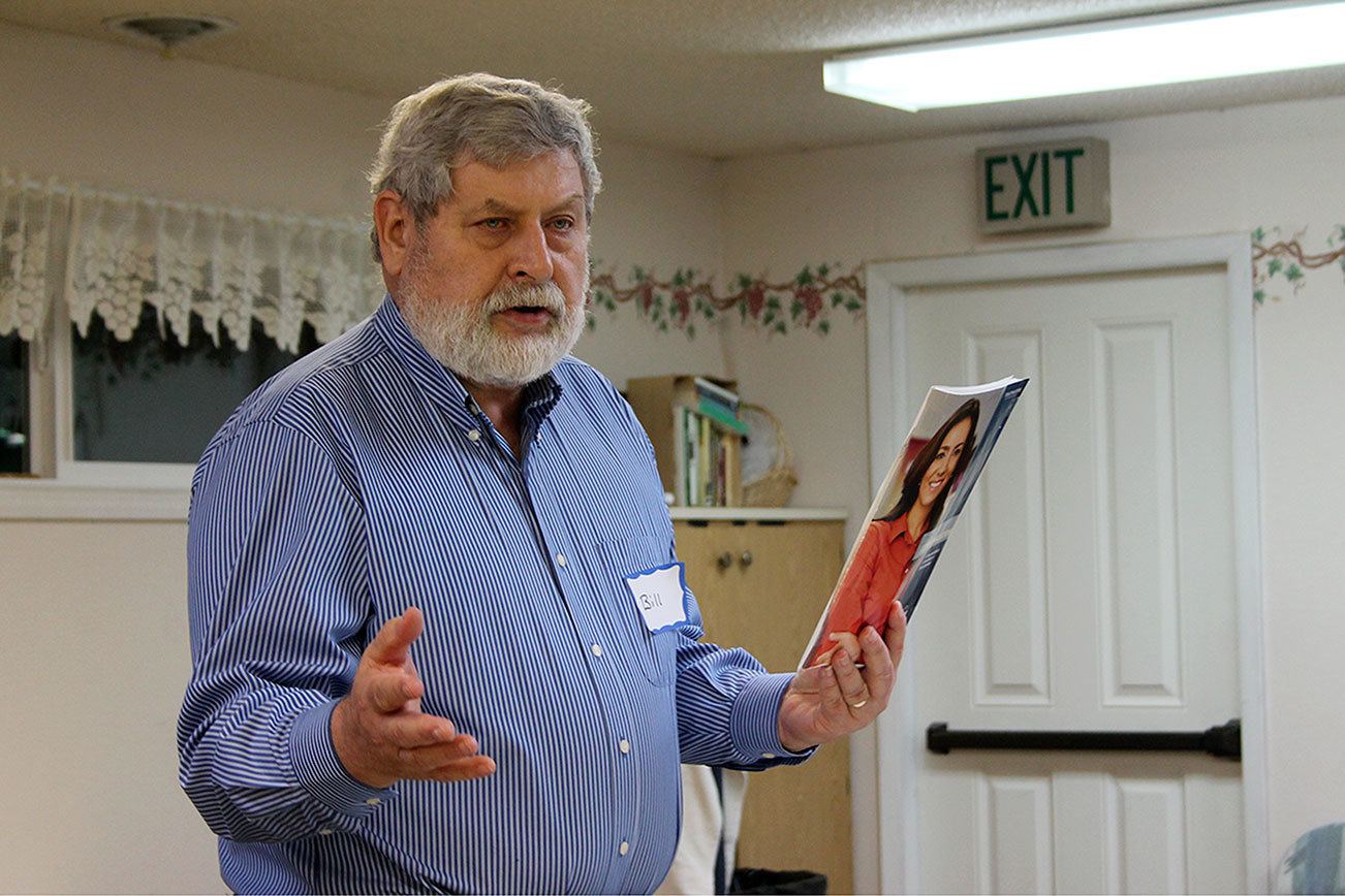 Kyle Jensen / The Record Langley resident Bill Marshall uses a visual aid while practicing a speech at the first open house for the local Toastmasters chapter, South Whidbey Sound Off.