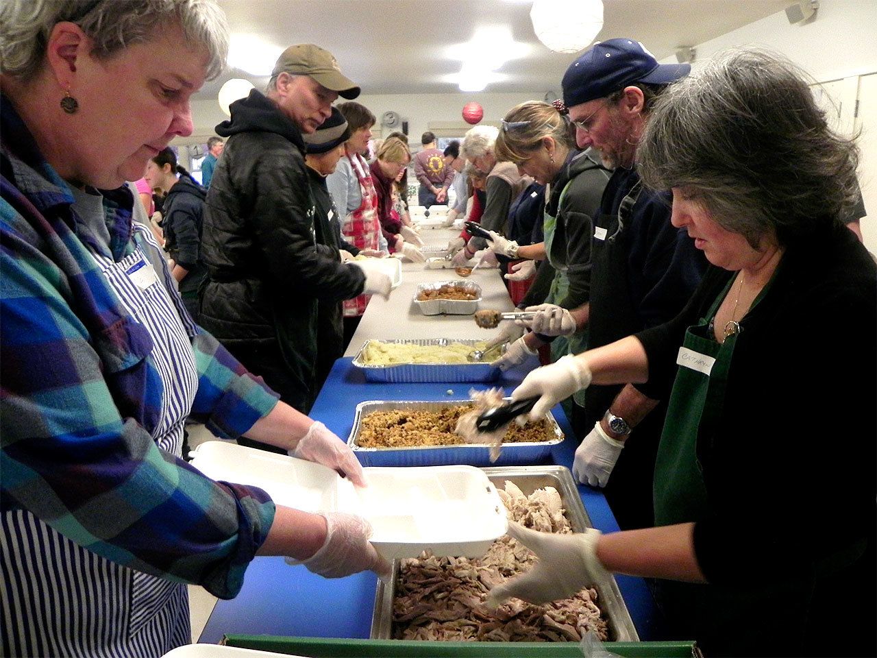 Record file                                A long line of volunteers packages dinners for those who otherwise wouldn&rsquo;t eat Thanksgiving.