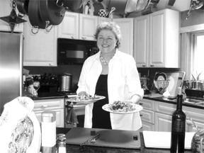 Maggie Korvin presents a lunch of Copper River salmon with a smoked portabello mushroom salad in a light balsamic dressing at her Langley home.  The caterer recently moved her business to Whidbey Island.