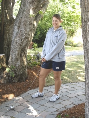 Georgia Tech and former Falcon thrower Kimery Hern stands with her 8.8-pound hammer