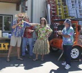 Mike Foley is named the winner of the Hawaiian shirt contest during Frontier Building Supply's