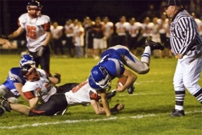 Running back Levi Sawyers flips over the defense during Friday’s 39-0 rout of Coupeville. The team travels to Sultan Oct. 12 and Falcon coach Mark Hodson said the team’s next goal is to win two of the final three games to obtain home field advantage in the playoffs.