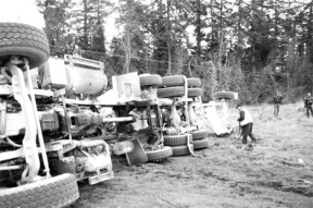 A concrete truck overturned at the intersection of Honeymoon Bay Road and Highway 525 Monday morning. The driver escaped with minor injuries.