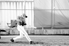 Sophomore JR Graham takes a solid swing then watches it go awry Monday as the Falcons win their first Cascade Conference game