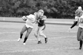 Defensive end James Jones holds on to his man during third quarter action Saturday as the Falcons beat Port Townsend 22-7.