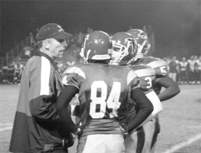 Assistant offensive coach Andy Davis imparts a little wisdom to Jesse Bartel