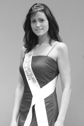 Freeland resident Katie Driscoll smiles for the judges during the evening gown portion of the Miss Washington USA pageant.
