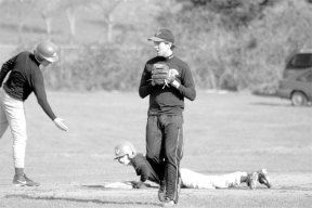 A teammate offers a helping hand to Nick Tenuta after being tagged at third by Patrick Smith. At 11 a.m. Saturday