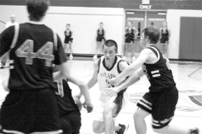Blake Blakey protects the ball during South Whidbey's 50-46 defeat of Cedarcrest Friday night.