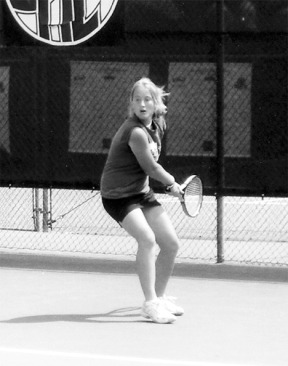 South Whidbey tennis champ Lindsey Newman returns a serve from arch-rival Erica Bosman at the Yakima Tennis Club Saturday. Newman won in two sets — 6-0
