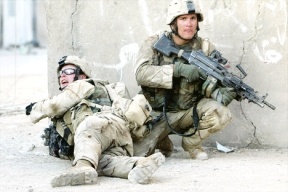 Former South Whidbey High School graduate Brandon Hern (kneeling) is pictured here while he served in Iraq from 2004-2005 with the Oregon National Guard.
