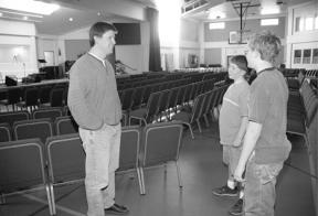 The Rev. Matt Chambers talks with his son