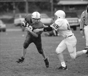 Seventh grade runningback Hunter Hawkins tests the Lake Stevens Middle School defense as he runs the ball early in the second half of Tuesday's season.