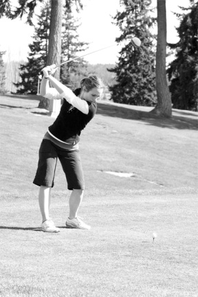 Emily Lindus tees off the first hole at Useless Bay Golf Course on Monday afternoon.