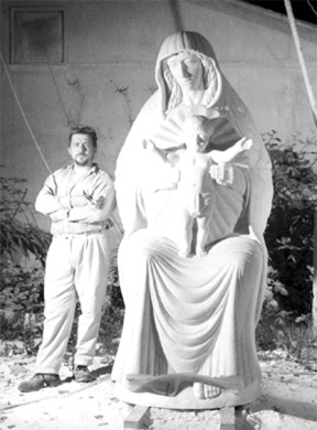 Russian born sculptor Alexei Kazantsev stands next to his sculpture of the Virgin Mary that is made from Italian marble. Many of Kazantsev's pieces are influenced by his study of early Christian art.