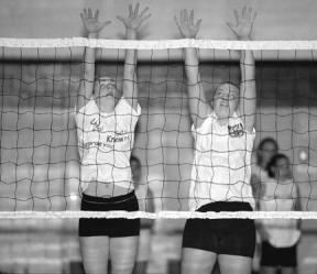 Brianna Hussey and Jordan Tobler go up for a blocking drill during practice this week. Both will be part of the 2002 varsity lineup.