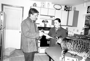 Real estate agent Steve O’Sullivan of Coldwell Banker/Tara Properties shows a house to potential client Maria Scott of Langley.