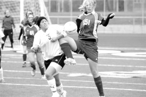 Freshman Megan Larmore fends off a Wildcat opponent during the Falcon's 2-0 loss to Archbishop Murphy on Saturday. The team went 11-9 this season
