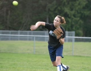 Allison Wood throws the ball during a fast-moving exercise designed to tag base runners while on the move.