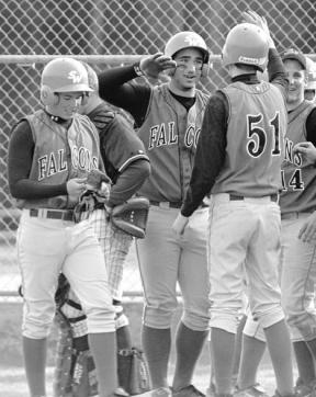 Senior Josh Coleman slaps hands after hitting his second home run of the day Wednesday to put the Falcons up 11-2. Unfortunately