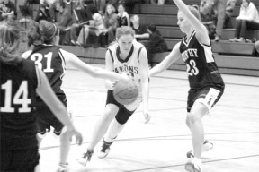 Freshman Cayla Calderwood seeks a way through the Wildcat defense in the third quarter of Tuesday's 37-28 loss to Archbishop Murphy.